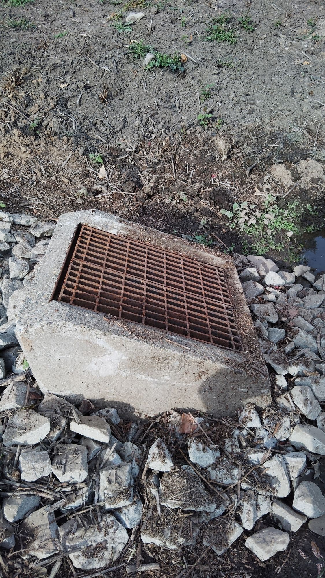 Maintenance team performing trash rack assessment
